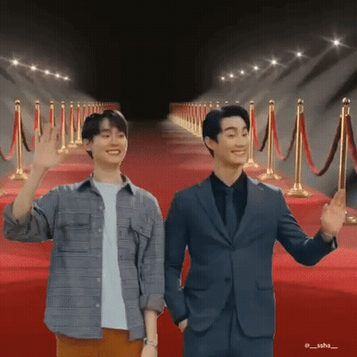 Two Men Standing On Red Carpet Waving GIF