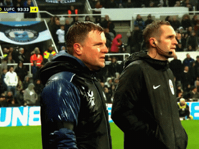 Two Men Standing On Soccer Field GIF