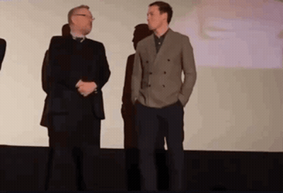 Two Men Standing On Stage GIF