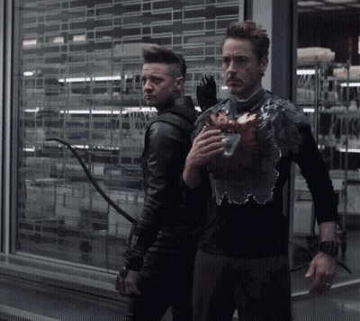 Two Men Standing One Holding Heart GIF