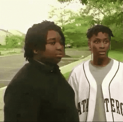 Two Men Standing One In Baseball Jersey GIF