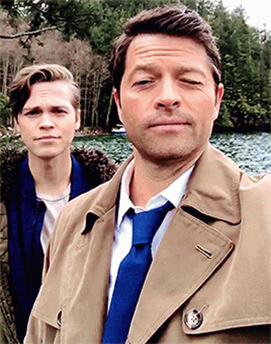 Two Men Standing One In Blue Tie GIF