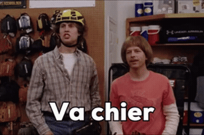 Two Men Standing One In Helmet Saying Va Chier GIF