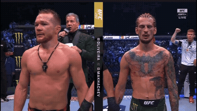 Two Men Standing One In UFC Shirt GIF