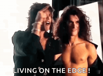 Two Men Standing One Shirtless GIF