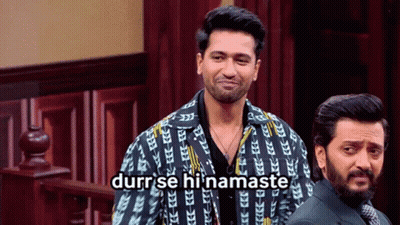 Two Men Standing One Wearing Durr Se Hi Namaste Jacket GIF