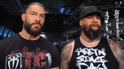 Two Men Standing, One Wearing RTC T-Shirt GIF