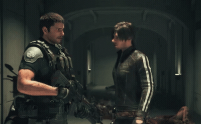 Two Men Standing One With Gun GIF