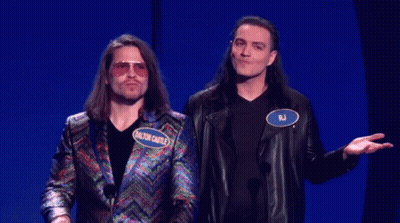 Two Men Standing One With RJ Name Tag GIF