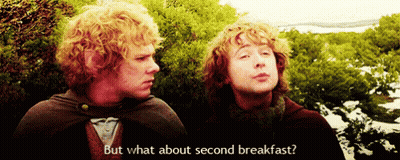 Two Men Standing Saying But What About Second Breakfast GIF