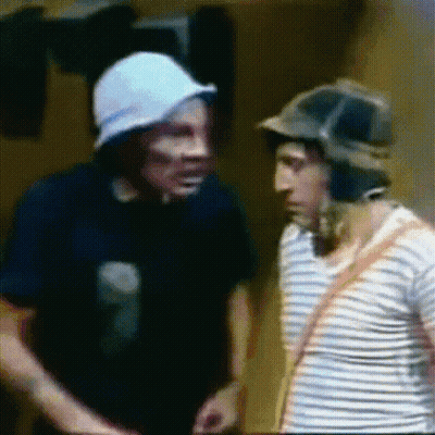 Two Men Standing Side By Side One Wearing Hat GIF