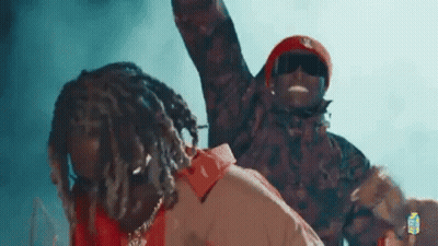 Two Men Standing Together On Stage GIF