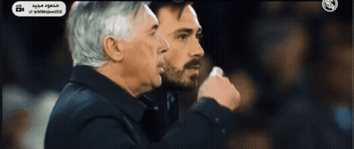 Two Men Standing With Arabic Writing GIF