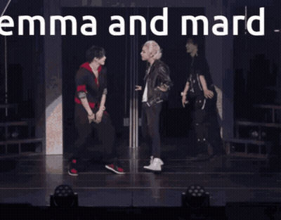 Two Men Standing With Emma And Mard GIF
