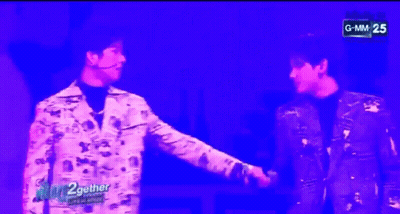 Two Men Standing With GMM On Screen GIF