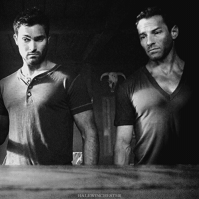 Two Men Standing With Halfwinchester GIF
