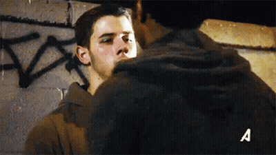 Two Men Standing With Letter A GIF