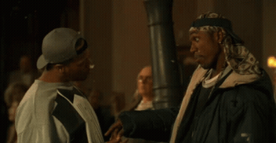 Two Men Standing With Popcorn On Screen GIF