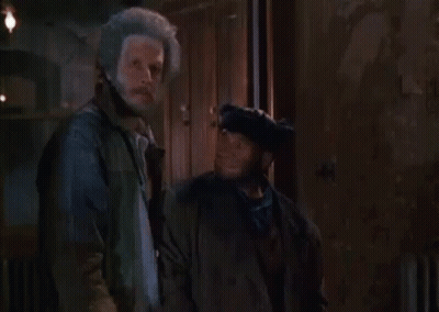 Two Men Standing With Words Never Behind GIF