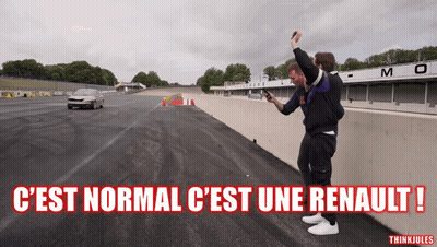 Two Men Taking Picture Of Car On Track C'est Normal C'est Une Renault GIF
