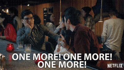 Two Men Talking At Bar GIF