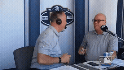 Two Men Talking At Microphone GIF