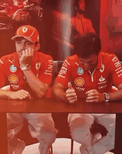 Two Men Talking At Table GIF