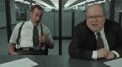 Two Men Talking At Table GIF