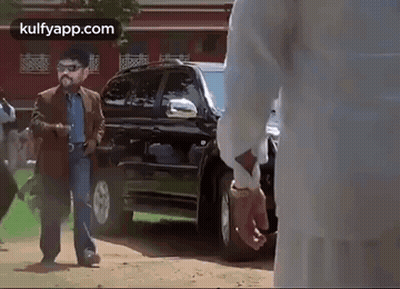 Two Men Talking By Open Trunk GIF