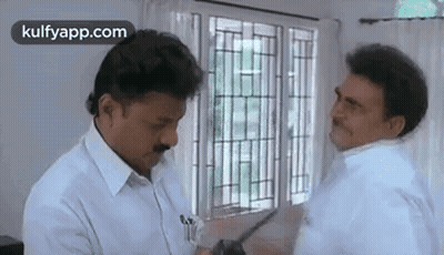 Two Men Talking By Window GIF