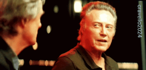 Two Men Talking Cirvello2024 Watermark GIF