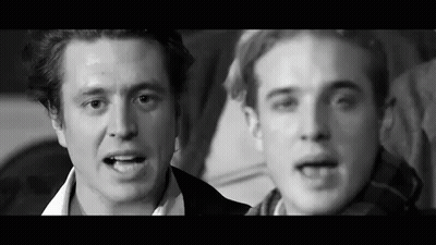 Two Men Talking In Black And White Photo GIF