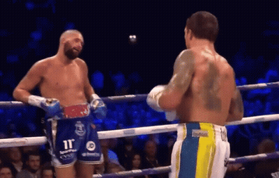 Two Men Talking In Boxing Ring, One With Back Tattoo GIF