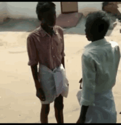 Two Men Talking In Sand GIF
