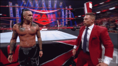 Two Men Talking In Wrestling Ring GIF