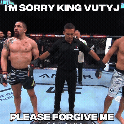Two Men Talking Next To Fight Week Sign GIF