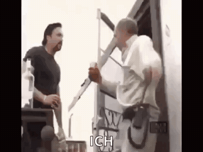 Two Men Talking Next To Truck GIF