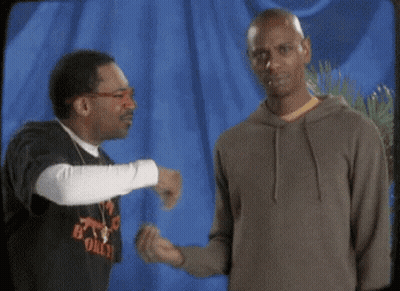 Two Men Talking, One In B Only Shirt GIF