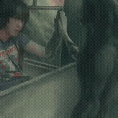 Two Men Talking One Wearing Iron Maiden Shirt GIF