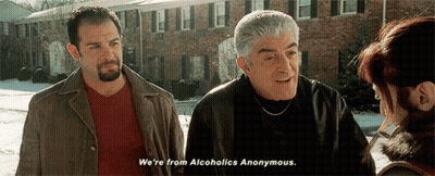 Two Men Talking To Woman By Brick Building GIF