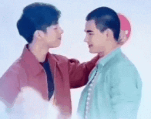 Two Men Touching Heads GIF
