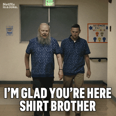 Two Men Walking Down A Hallway With A Sign That Says Science Fair Winners On It GIF