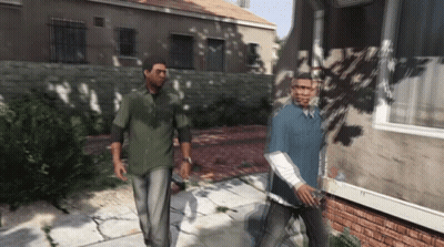 Two Men Walking Down Sidewalk GIF