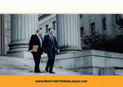 Two Men Walking Down Stairs With The Website Www.newyorkcriminallawyer.com In The Background GIF
