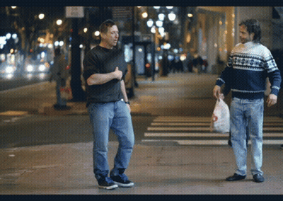 Two Men Walking One In Snowflake Sweater GIF