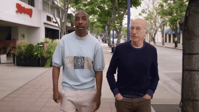 Two Men Walking Past Supreme Restaurant GIF