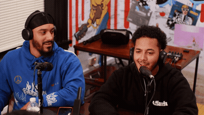 Two Men Wearing Headphones And A Hoodie That Says Atlanta On It GIF