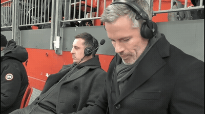 Two Men Wearing Headphones And A Jacket That Says Goose On It GIF