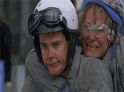 Two Men Wearing Helmets And Goggles Are Posing For A Photo GIF