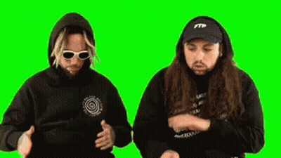 Two Men Wearing Hoodies And Hats Are Dancing On A Green Screen . GIF
